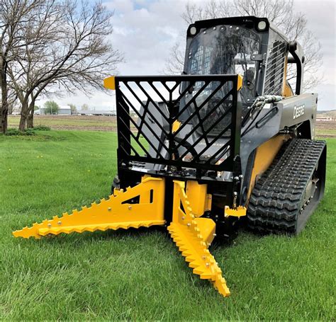 pulling stumps with skid steer|skid loader tree puller attachment.